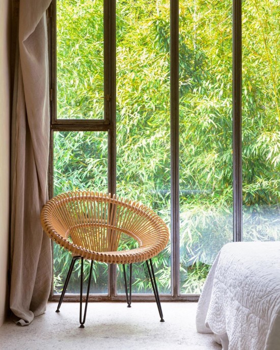 Vincent Sheppard Fauteuil Cruz naturel Cruz Lazy Fauteuil cadre en Acier Revêtement en poudre noir Rotin Naturel.